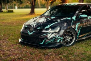 Bright abstract theme custom car parked in a serene park environment.