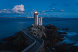 Night view of Petit Minou lighthouse on the coast of Brittany, France.
